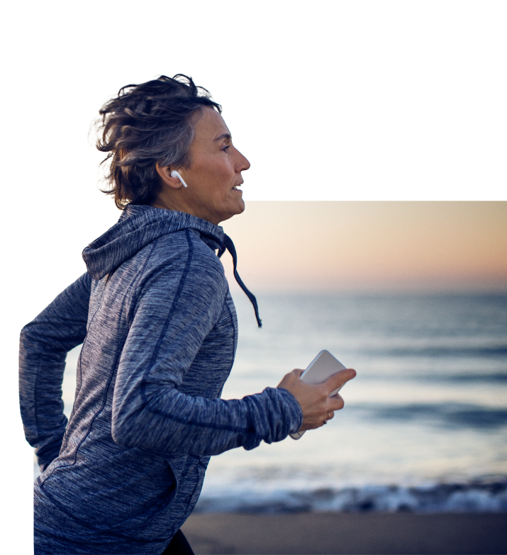 Woman running on the shore